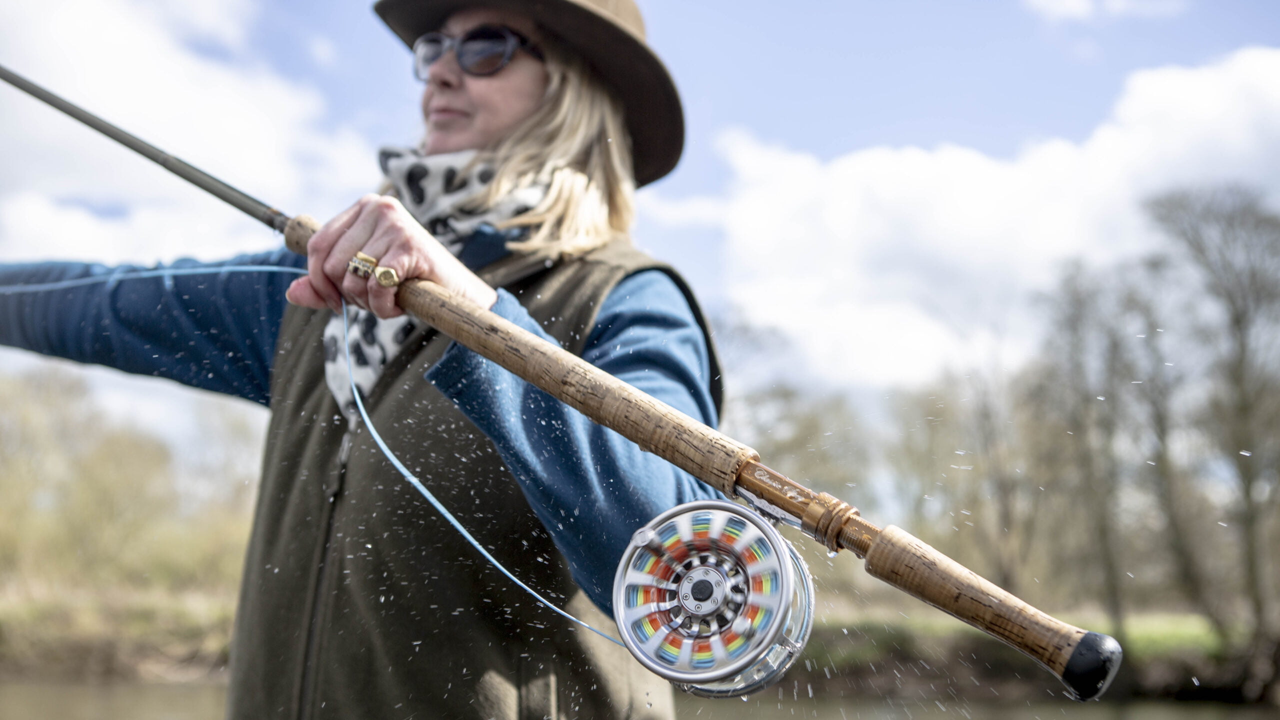 Woman with a fishing rod.